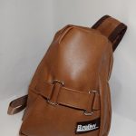 Faux leather sling bag with buckles